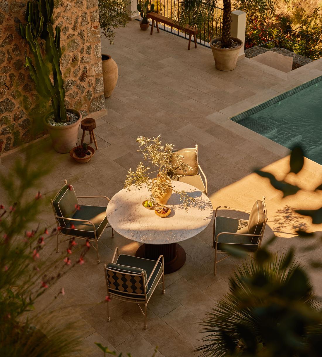Murcell Outdoor Round Dining Table - Carrara - Lifestyle - Image 1